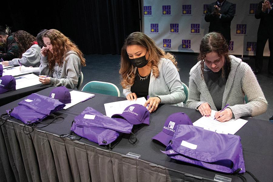 Students are seen signing letters of intent at last year's event in the Connie Gotsch Theatre.