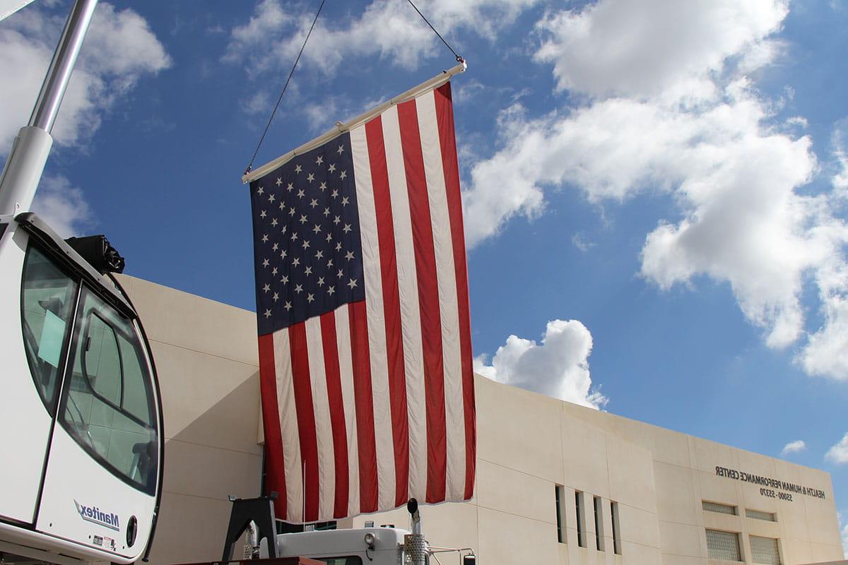 The American Flag hangs in front of the Health and Human Performance Center for SJCs Veterans Center Stand Down event in 2022